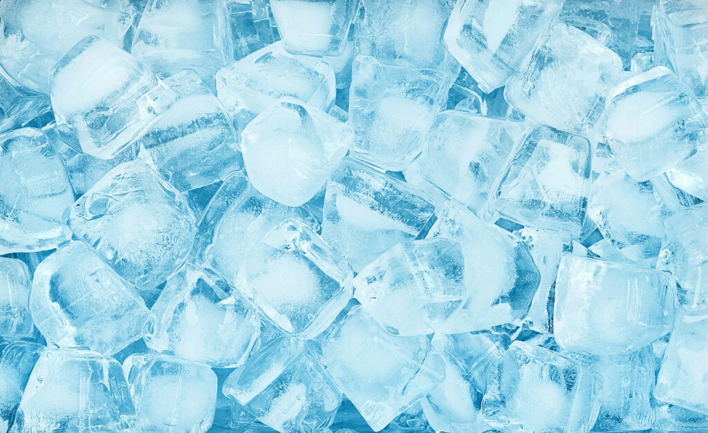 Pile of clear ice cubes, representing cold therapy treatment to help ice reduce varicose vein pain.